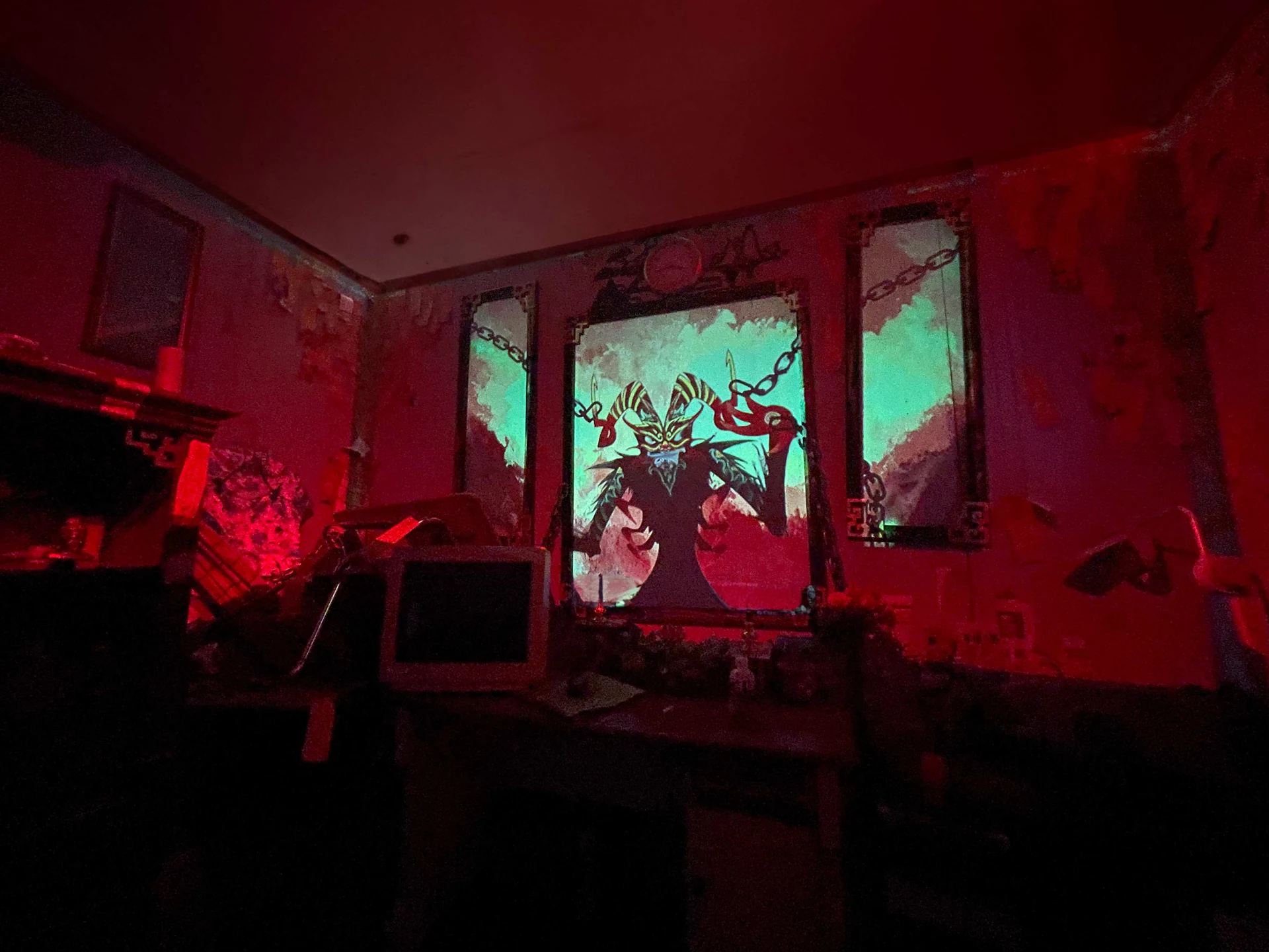 The Chú Mó room with demon projection, ritual furnishings, and physical stations
